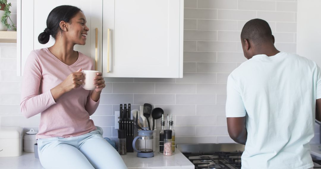 Couple Enjoying Conversation in Modern Kitchen Setting