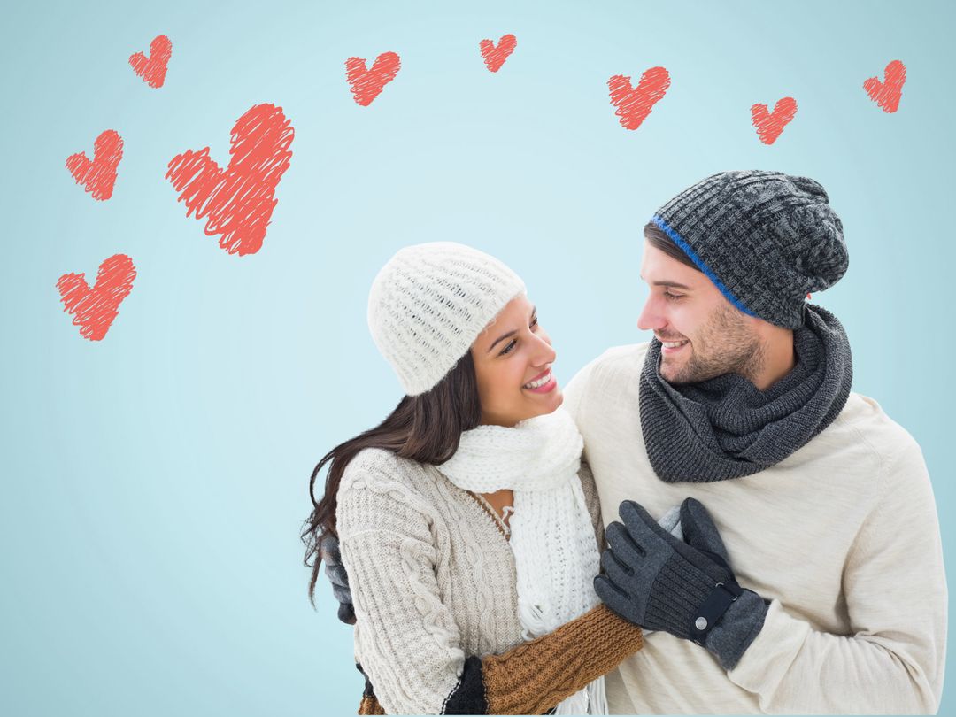 Smiling Couple in Winter Clothing Surrounded by Hearts emoticons - Download Free Stock Templates Pikwizard.com