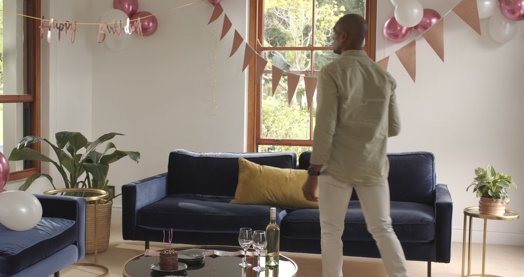 Man Dancing at Home Birthday Party with Decorations