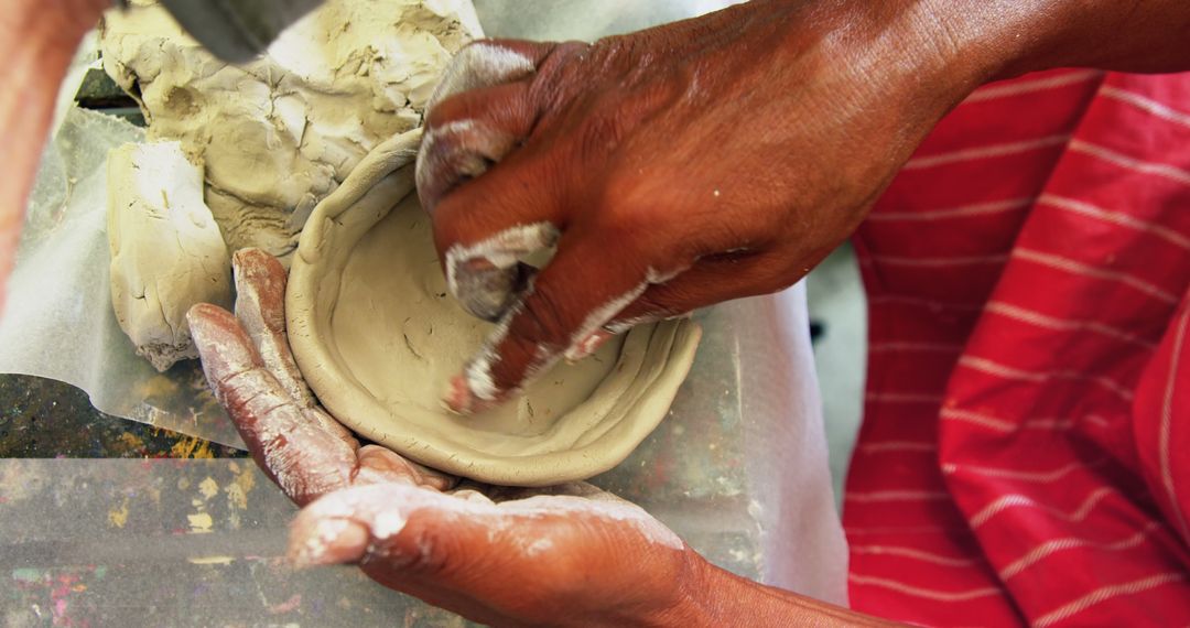 Craftsman Shaping Clay Pot with Skilled Hands - Free Images, Stock Photos and Pictures on Pikwizard.com