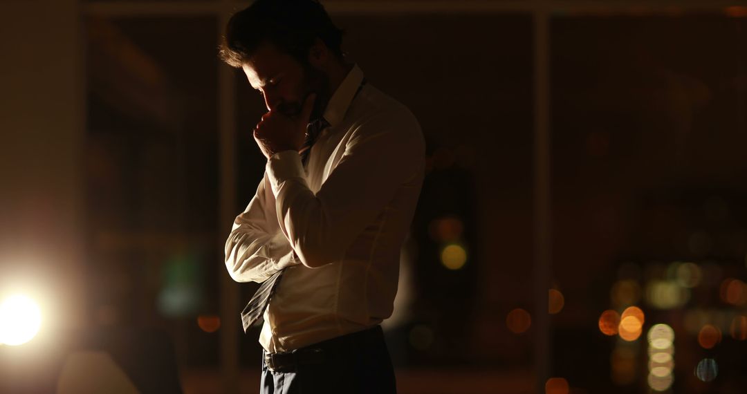 Pensive Businessman Contemplating in Office Late Night - Free Images, Stock Photos and Pictures on Pikwizard.com