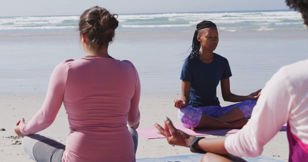 Group of Women Meditating on Beach at Sunrise - Free Images, Stock Photos and Pictures on Pikwizard.com