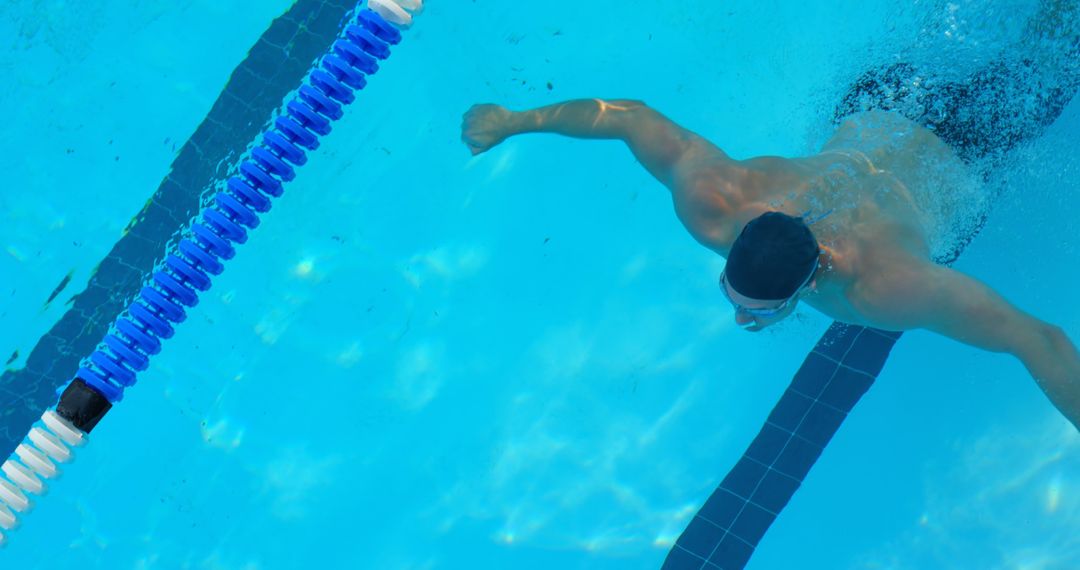 Professional Swimmer Practicing Butterfly Stroke in Competition Pool - Free Images, Stock Photos and Pictures on Pikwizard.com