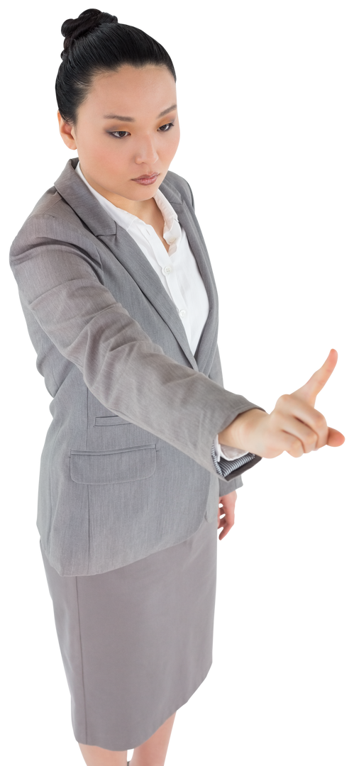 Focused Asian Businesswoman Pointing at Transparent Interface - Download Free Stock Images Pikwizard.com