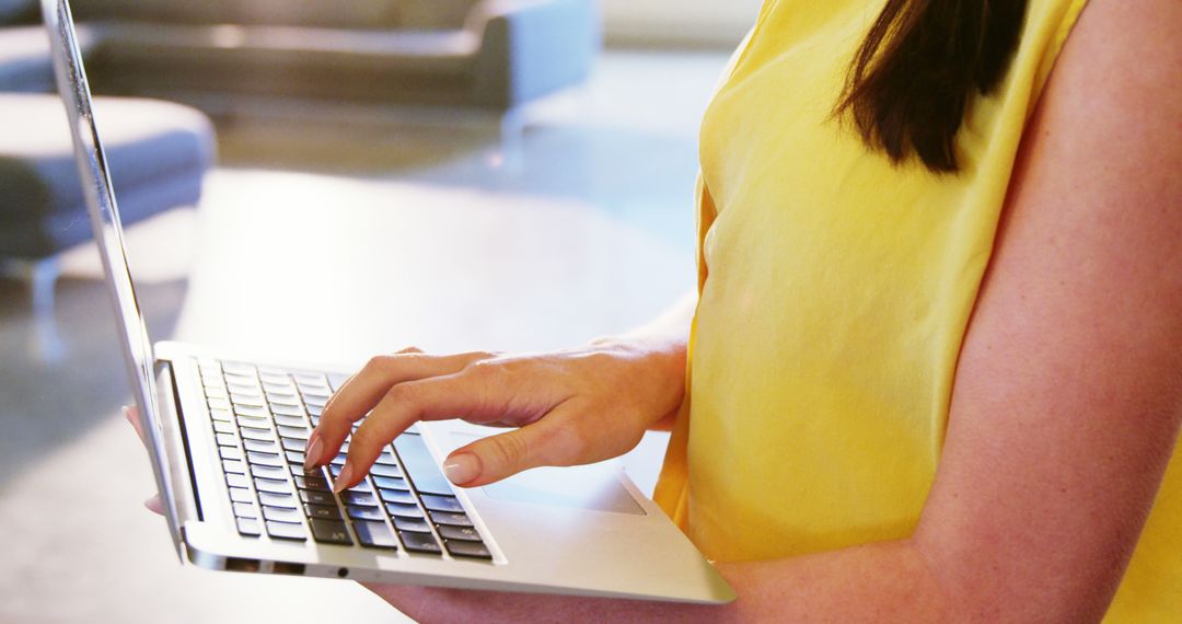 Woman Typing on Laptop in Bright Office - Free Images, Stock Photos and Pictures on Pikwizard.com