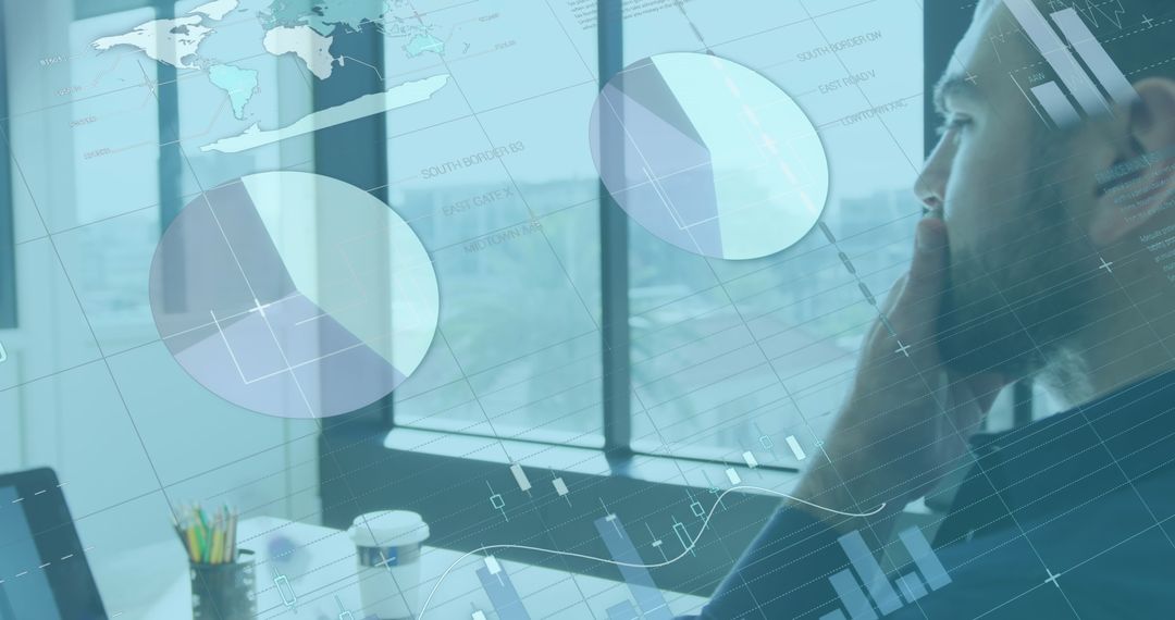 Businessman Analyzing Data with Digital Graphics Overlay