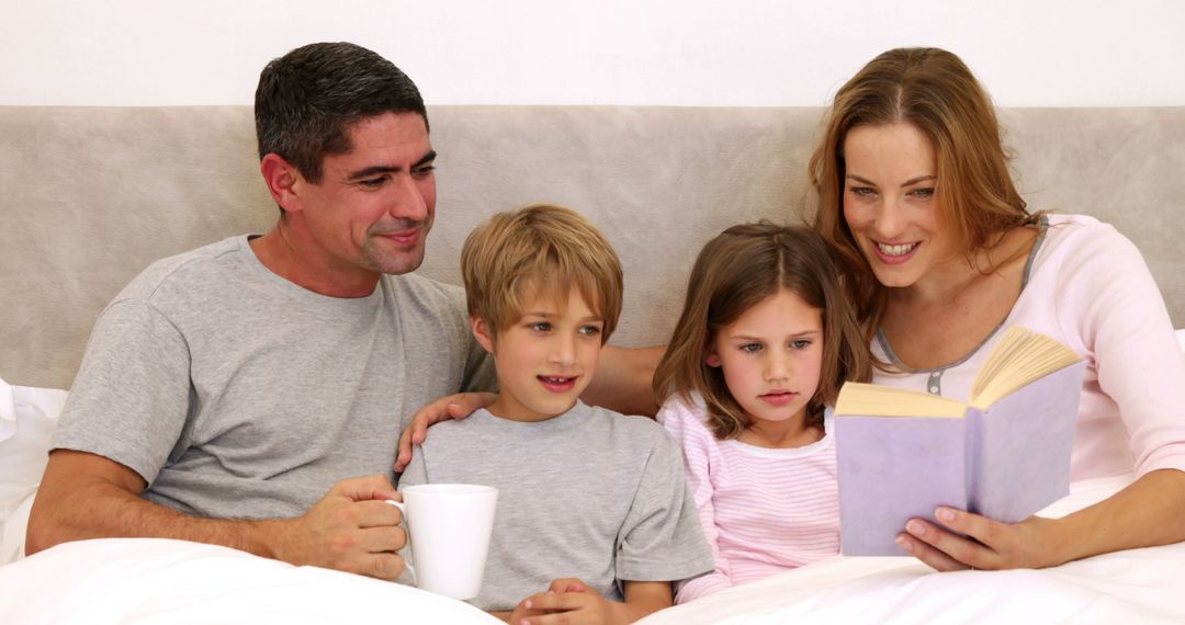 Happy Family Reading Together on Bed - Free Images, Stock Photos and Pictures on Pikwizard.com