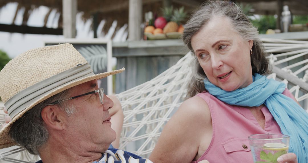 Senior Couple Relaxing in Hammock on Summer Vacation - Free Images, Stock Photos and Pictures on Pikwizard.com