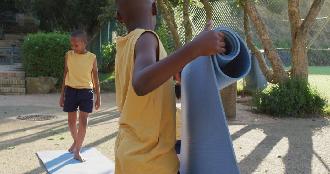 Children Practicing Yoga Outdoors in Sunshine - Free Images, Stock Photos and Pictures on Pikwizard.com