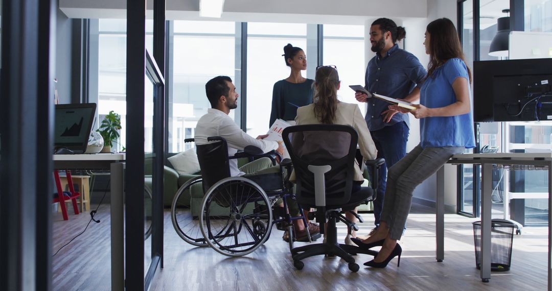 Inclusive Team Meeting in Modern Office with Disabled Employee - Free Images, Stock Photos and Pictures on Pikwizard.com