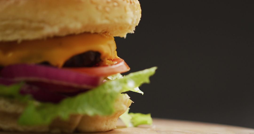 Close-up Delicious Cheeseburger with Fresh Lettuce and Tomato - Free Images, Stock Photos and Pictures on Pikwizard.com