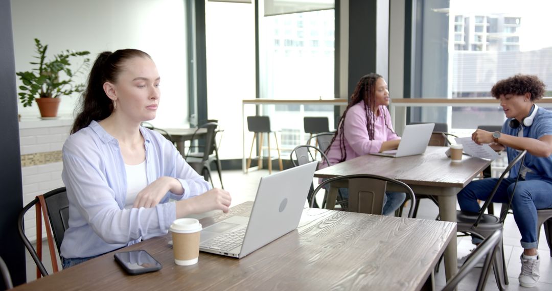 Diverse Professionals Collaborating in Modern Workplace