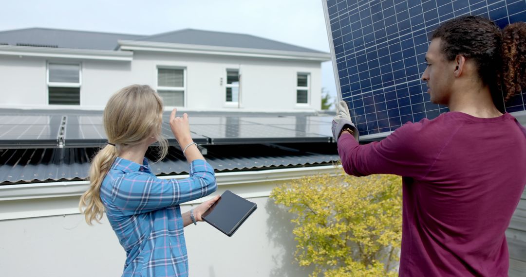 Technicians Installing Solar Panels on Residential Roof - Free Images, Stock Photos and Pictures on Pikwizard.com