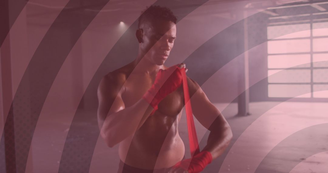 Determined Boxer Wrapping Hands in Intense Gym Setting