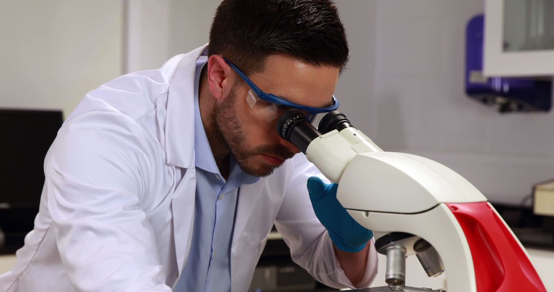 Scientist Using Microscope in Modern Laboratory - Free Images, Stock Photos and Pictures on Pikwizard.com