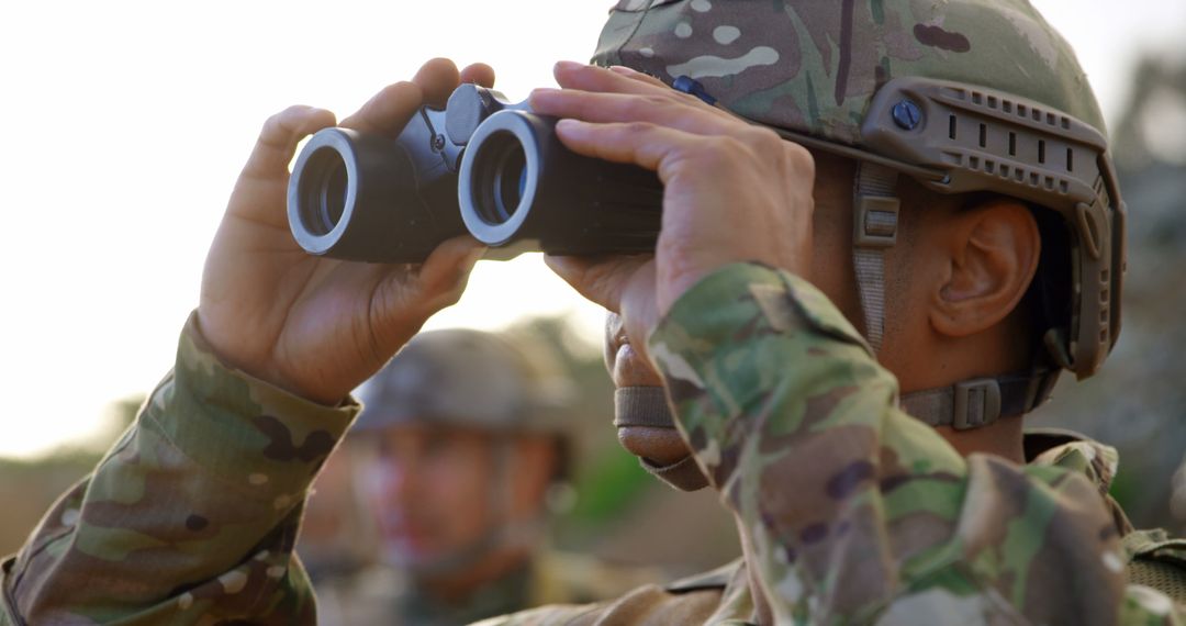 Soldier in Camouflage Uniform Using Binoculars - Free Images, Stock Photos and Pictures on Pikwizard.com