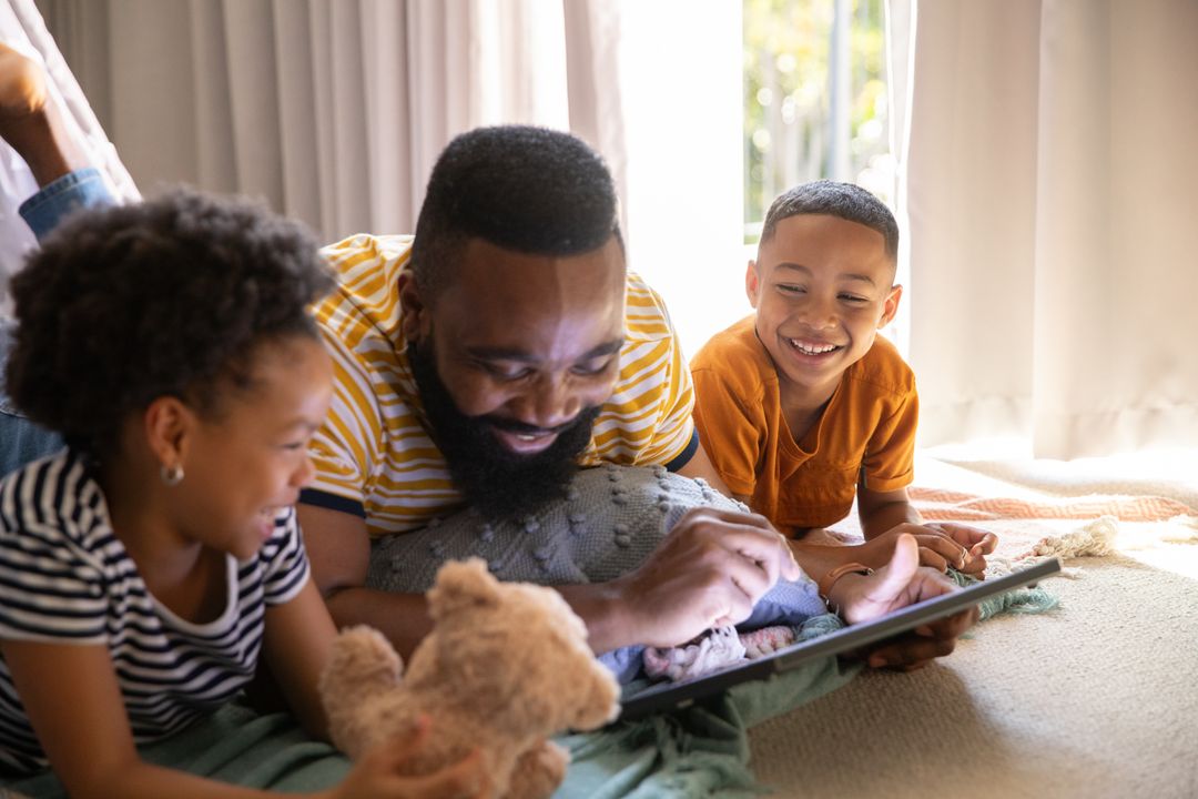 Diverse Family Relaxing Together Enjoying Tablet Time