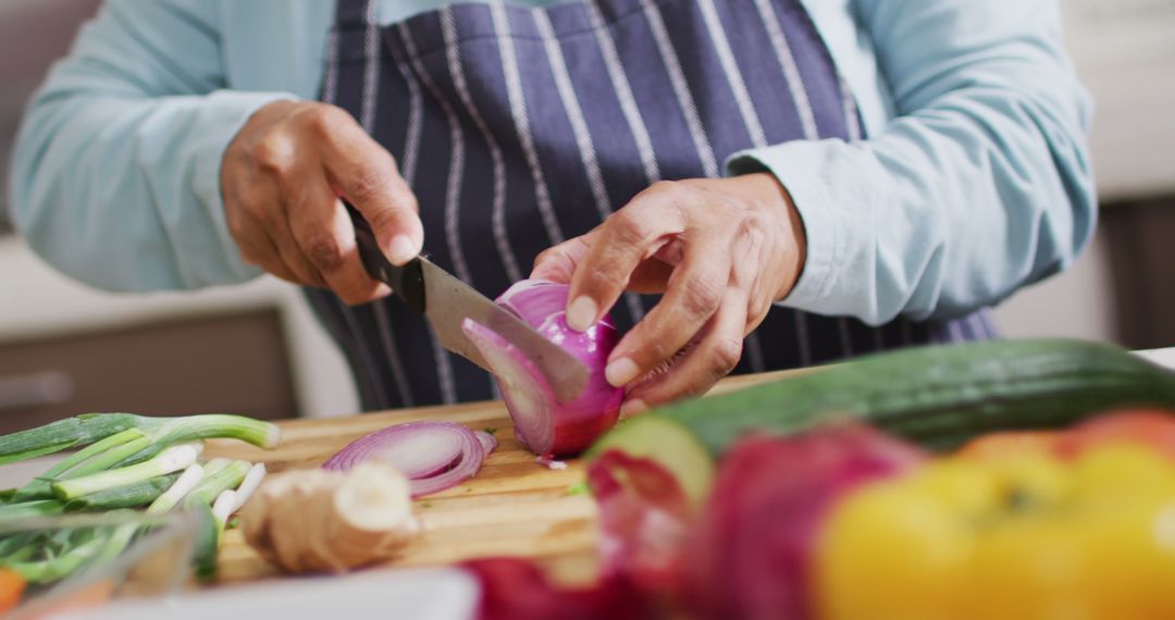 Close-up of Chef Cutting Red Onion in Kitchen - Free Images, Stock Photos and Pictures on Pikwizard.com