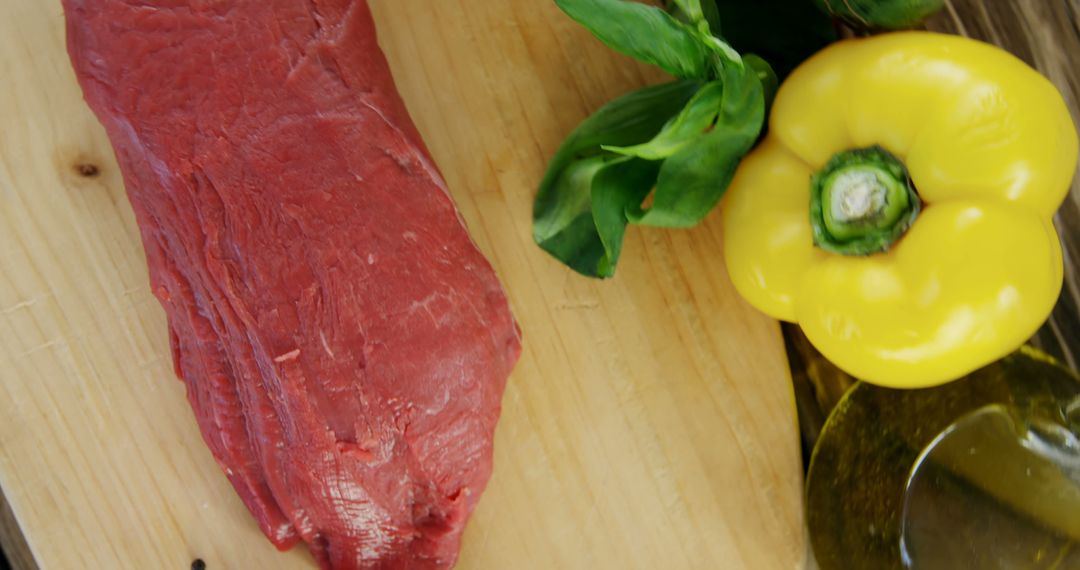 Fresh Beef Cut on Wooden Board with Yellow Bell Pepper - Free Images, Stock Photos and Pictures on Pikwizard.com