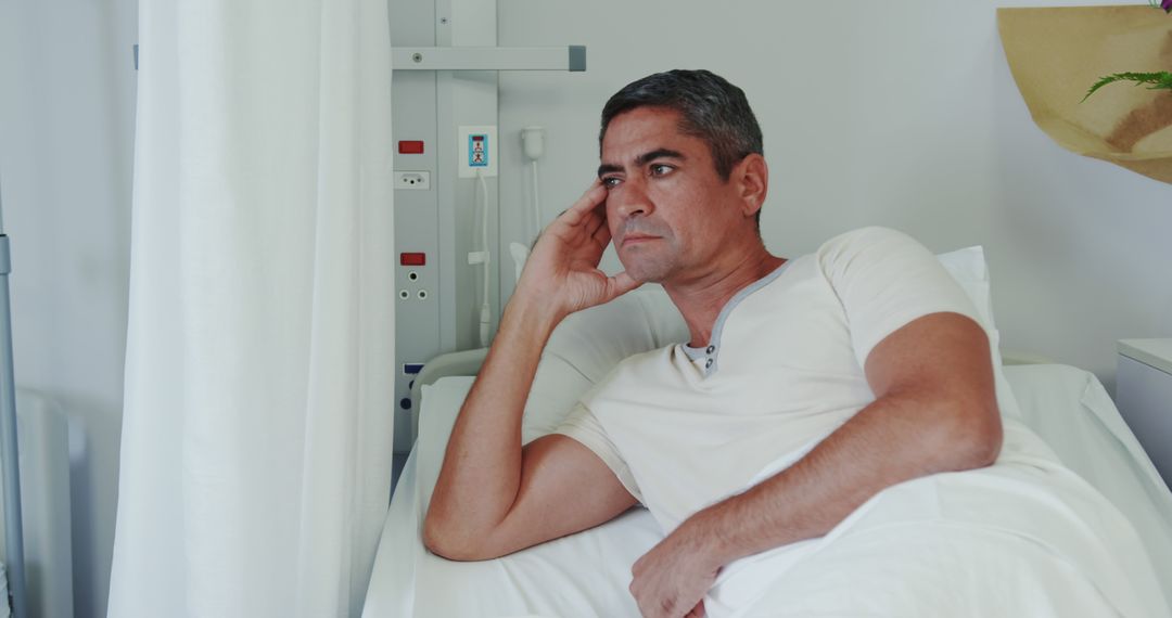 Pensive Man Resting In Hospital Bed - Free Images, Stock Photos and Pictures on Pikwizard.com