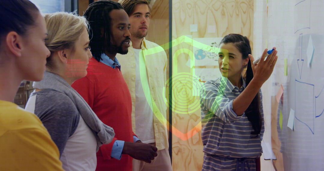 Diverse Team Brainstorming with Glass Whiteboard in Office