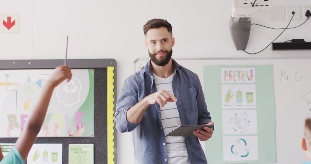 Young Teacher Uses Tablet for Interactive Classroom Lesson - Free Images, Stock Photos and Pictures on Pikwizard.com