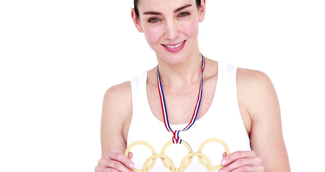 Woman Wearing Olympic Medal and Holding Gold Rings on White Background - Free Images, Stock Photos and Pictures on Pikwizard.com