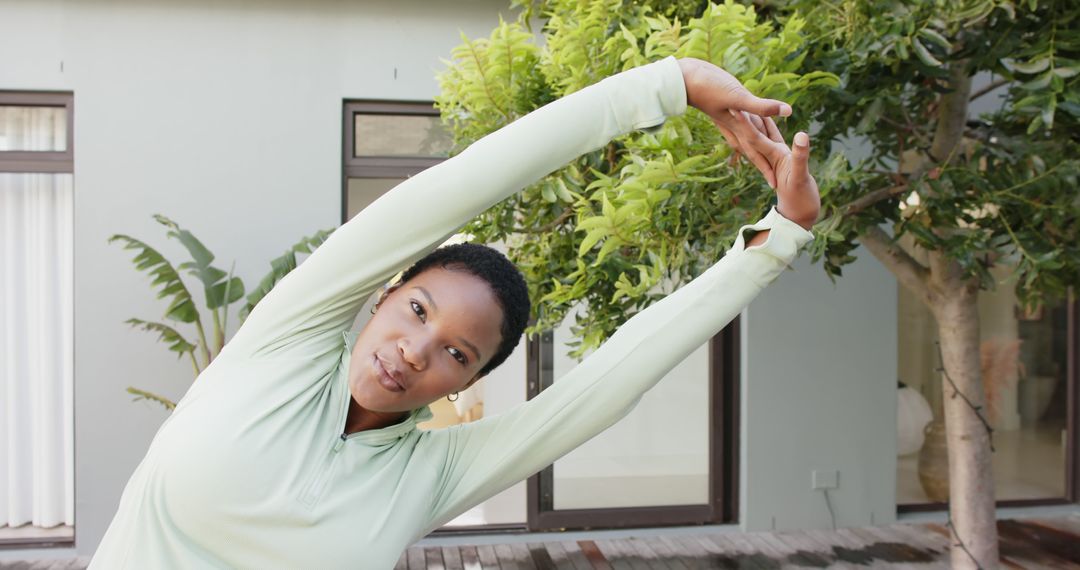 Young Woman Stretching Outdoors for Fitness Routine - Free Images, Stock Photos and Pictures on Pikwizard.com