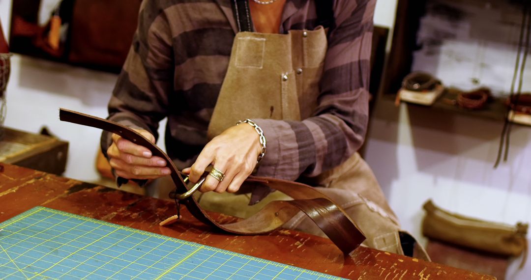 Craftsman Working on Leather Belt in Workshop - Free Images, Stock Photos and Pictures on Pikwizard.com