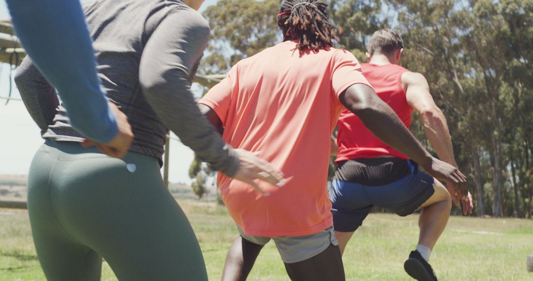 Diverse Group Participating Outdoor Obstacle Training