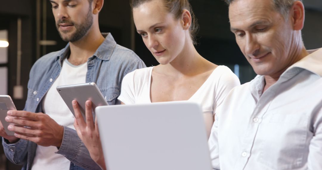 Collaborative Professionals Engaged with Digital Devices