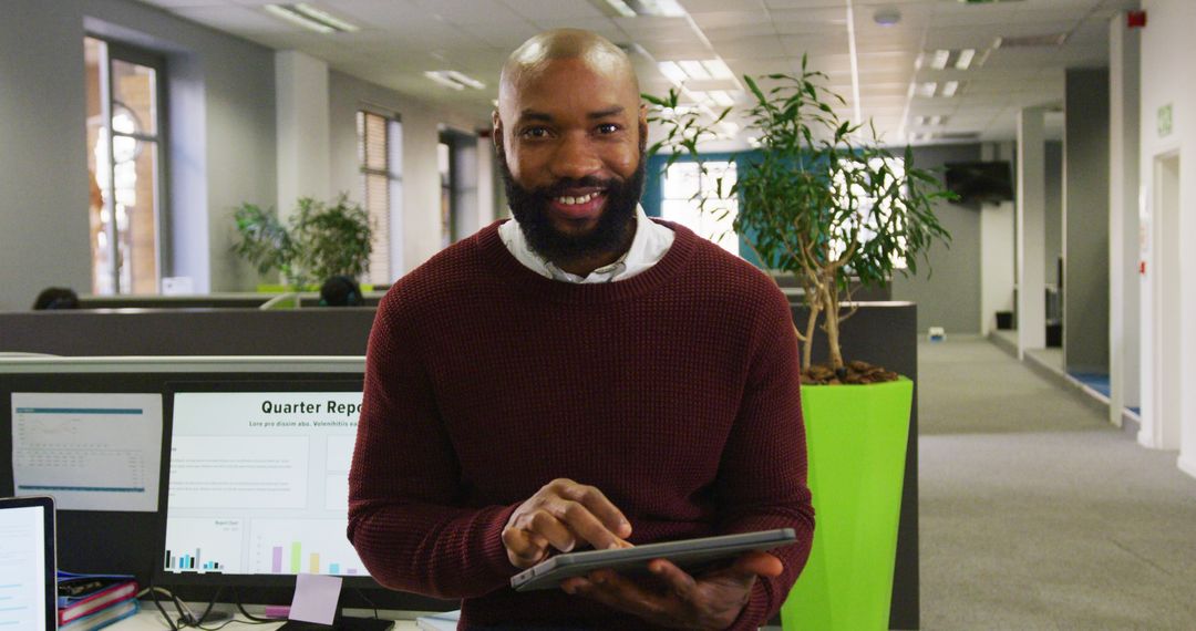 Smiling Employee Using Tablet in Modern Open Plan Office - Free Images, Stock Photos and Pictures on Pikwizard.com