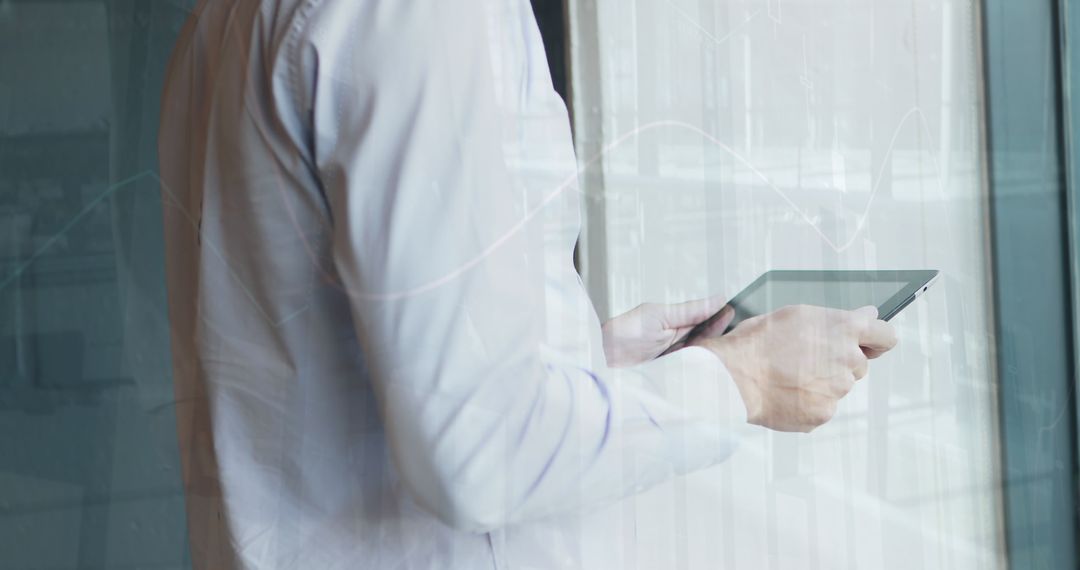 Business Professional Holding Tablet and Analyzing Data