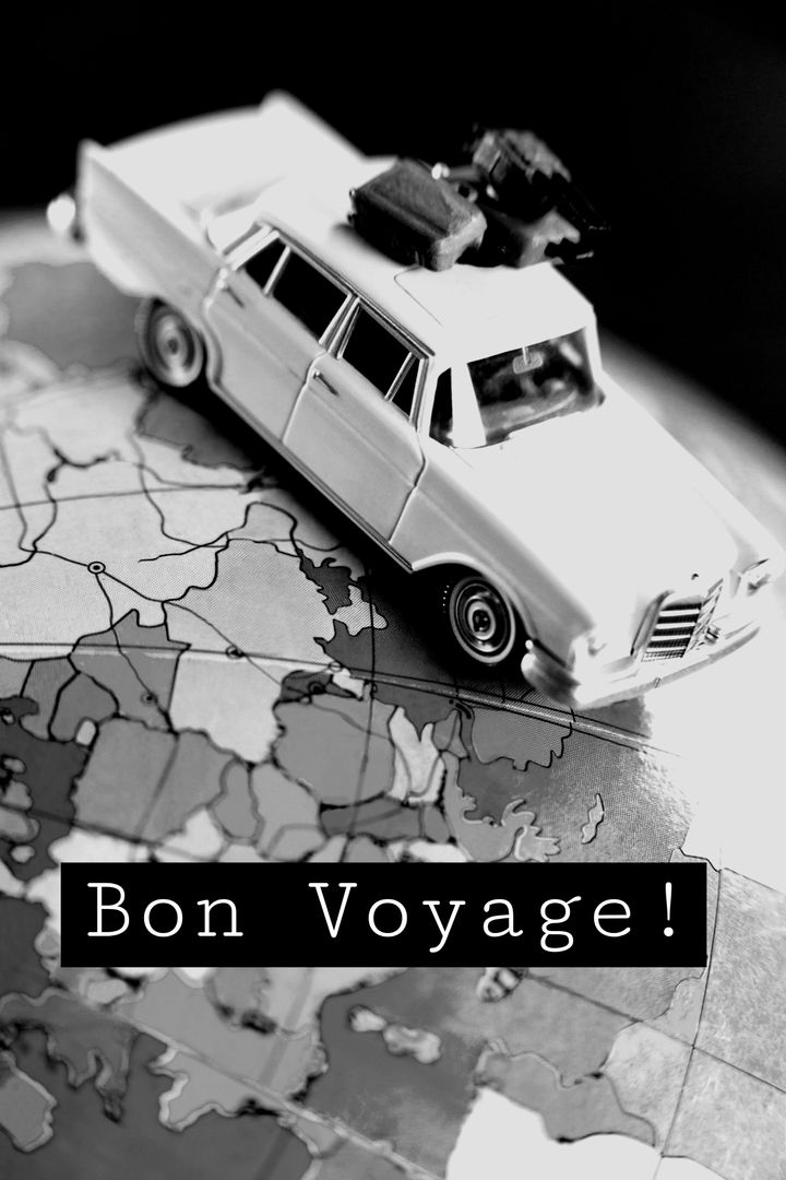 Miniature Vintage Car on World Map Symbolizing Travel