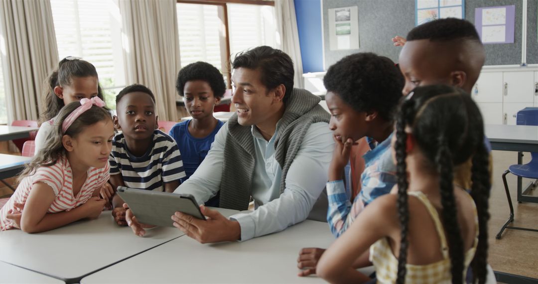 Teacher Using Tablet with Diverse Group of Engaged Students - Free Images, Stock Photos and Pictures on Pikwizard.com