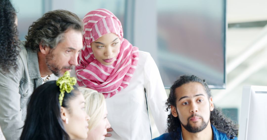 Diverse Professional Team Collaborating in Office Discussion