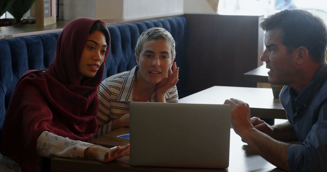 Diverse Students Collaborating on Project with Focused Teamwork