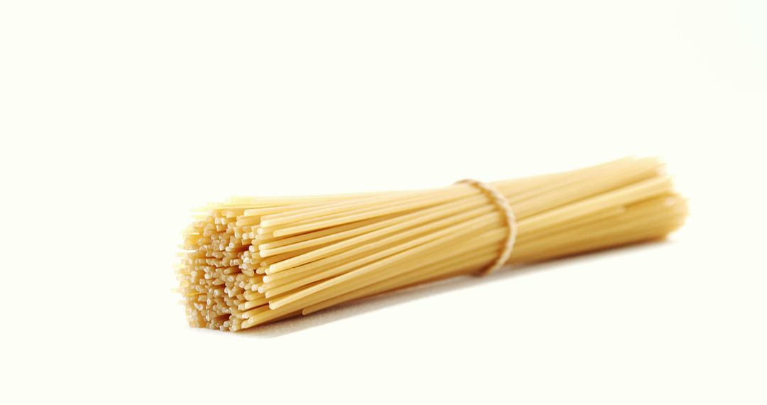 Bundle of Uncooked Spaghetti on White Background - Free Images, Stock Photos and Pictures on Pikwizard.com