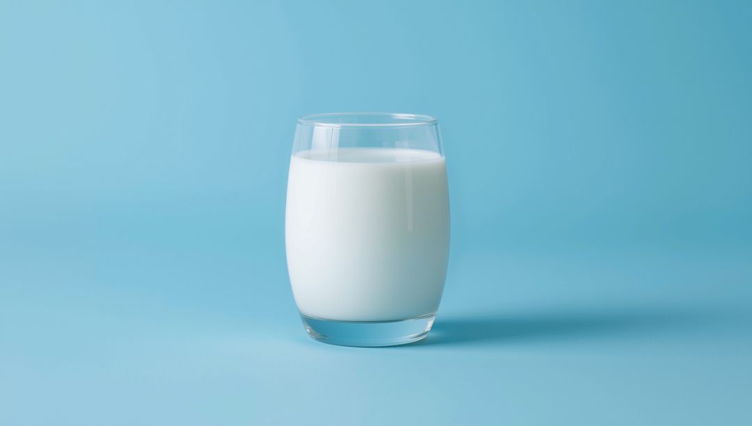 Minimalist Glass of Milk on Soft Blue Background