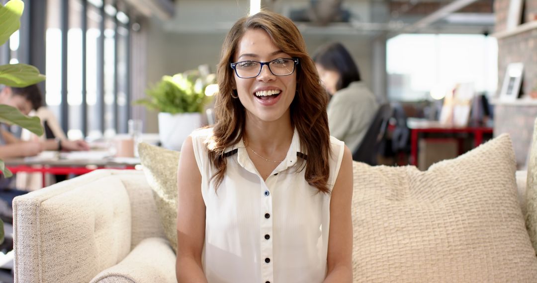 Successful Young Professional Smiling in Modern Coworking Space