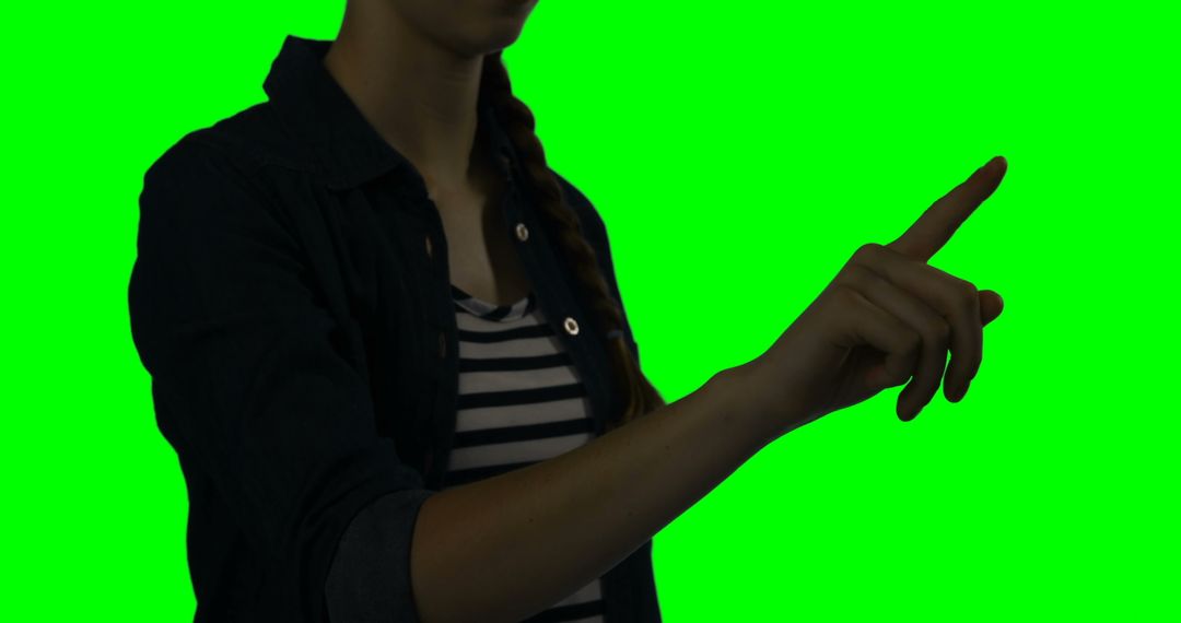 Woman using touchscreen gesture against green chroma key background - Free Images, Stock Photos and Pictures on Pikwizard.com