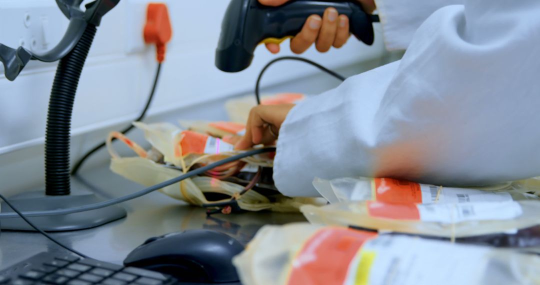 Technician Scanning Blood Bags with Barcode Scanner in Laboratory - Free Images, Stock Photos and Pictures on Pikwizard.com