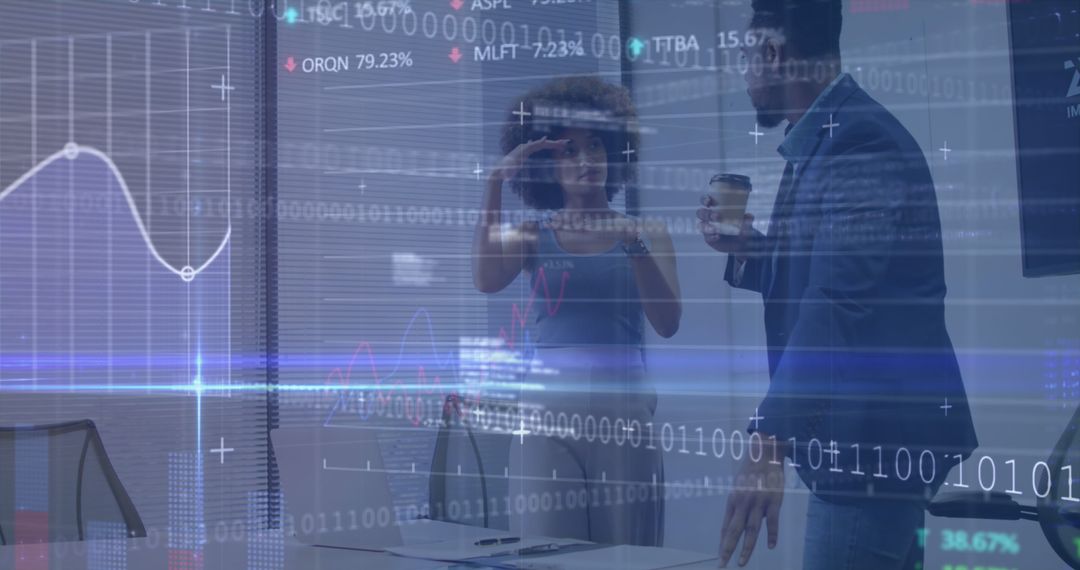 Diverse Coworkers Analyzing Financial Data in Modern Office Space