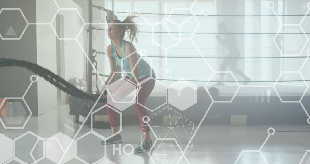 Woman Exercising with Battle Ropes and Chemical Formula Overlay in Gym - Free Images, Stock Photos and Pictures on Pikwizard.com