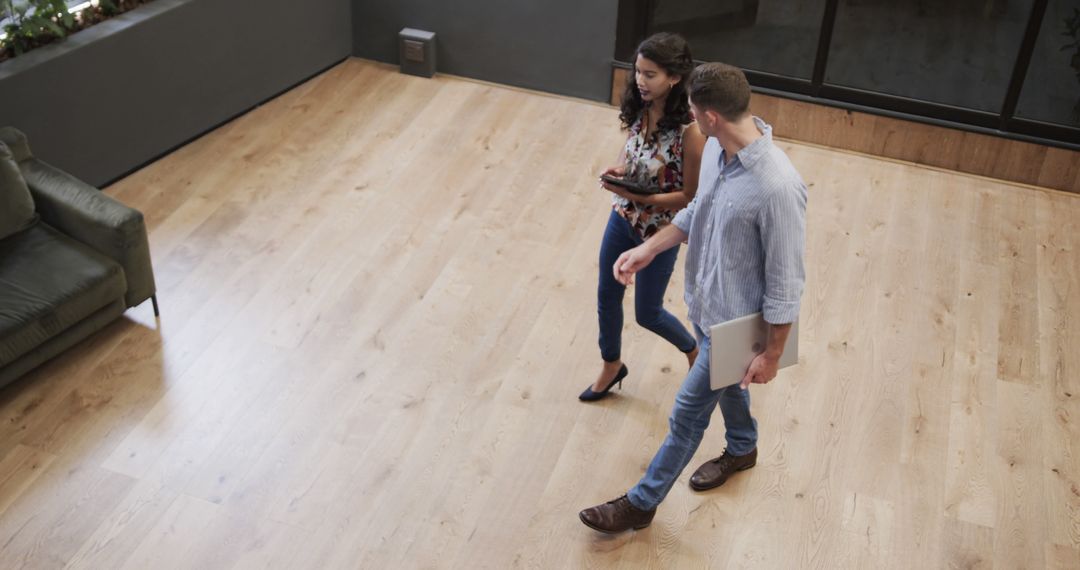 High Angle View of Colleagues Walking Through Office Foyer