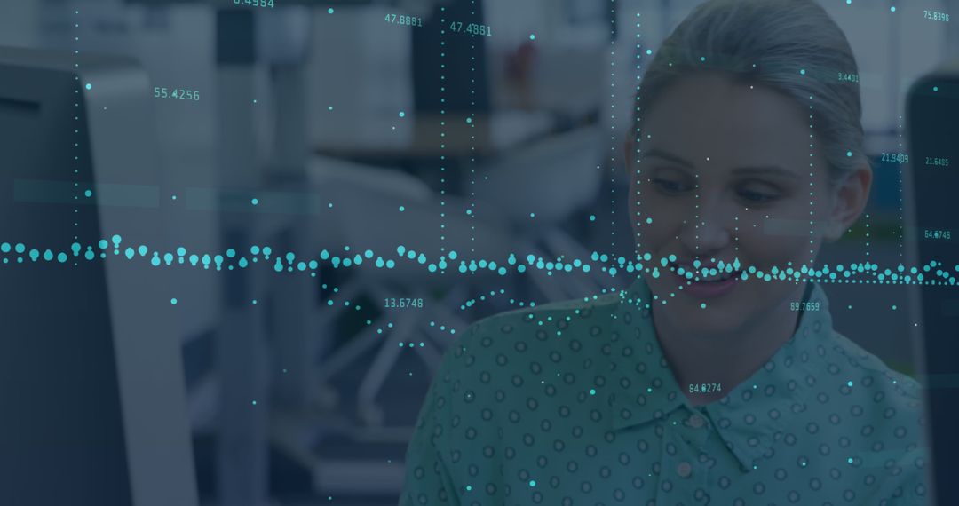 Smiling Businesswoman Analyzing Data on Computer Screen