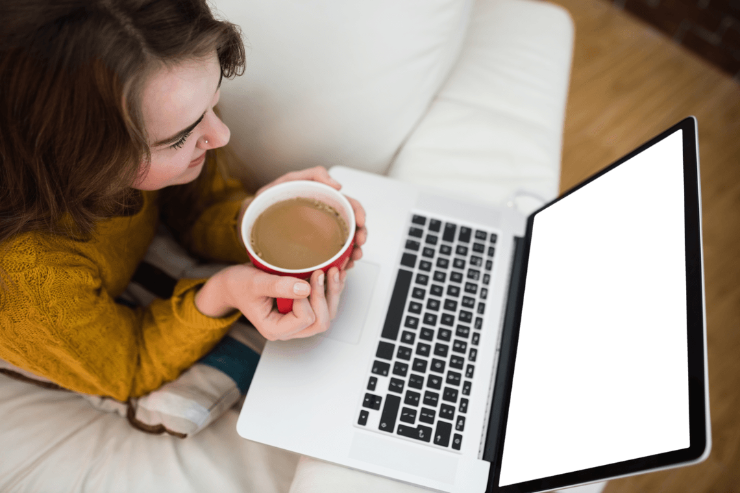Smiling Woman Drinking Coffee and Using Transparent Laptop at Home