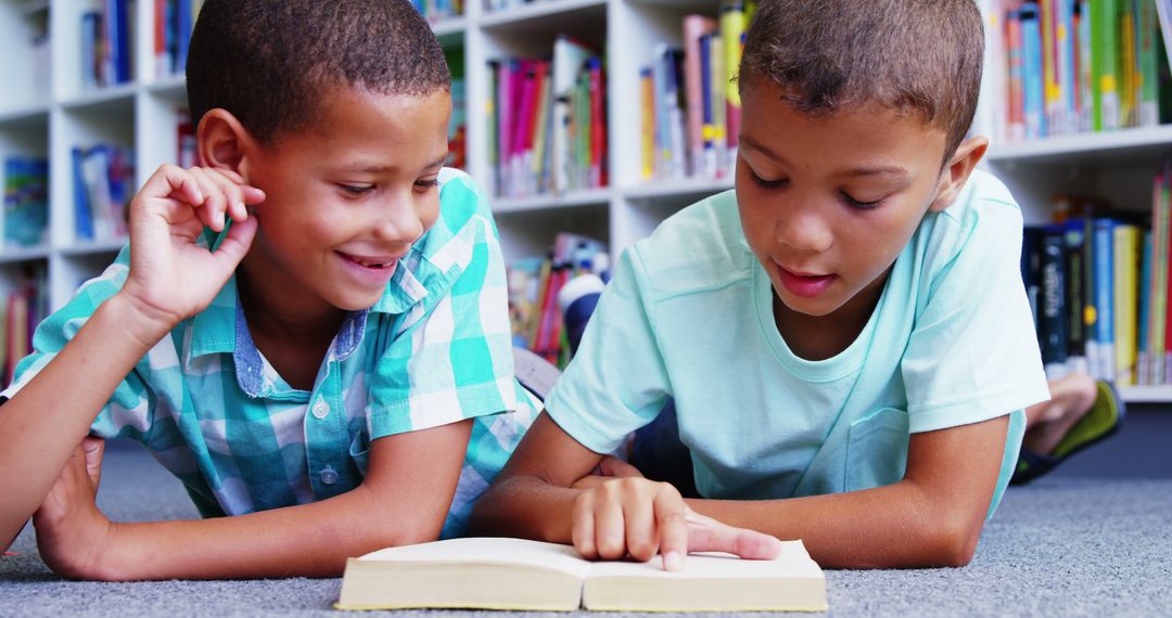 Two Young Boys Reading Book in Library - Free Images, Stock Photos and Pictures on Pikwizard.com