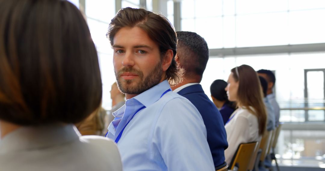 Businessman Attending Seminar with Confident Smile