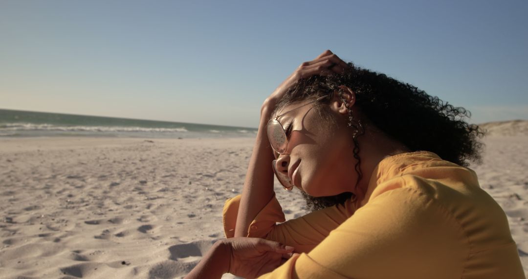 Tranquil Woman Relaxing on Sandy Beach under Clear Blue Sky - Free Images, Stock Photos and Pictures on Pikwizard.com